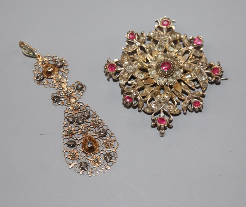An Indian? white and yellow metal, rose cut diamond and ruby set flowerhead brooch, 48mm & an earring.